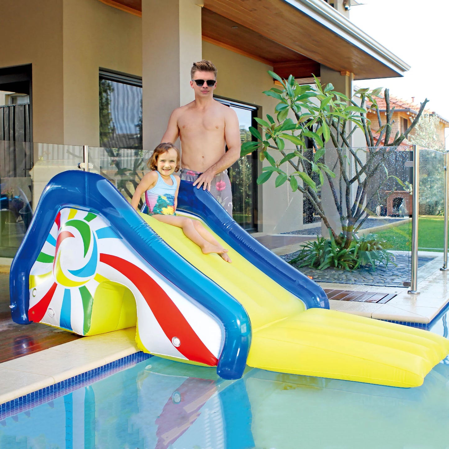 Northlight yellow and blue pool side slide with an attached sprayer, 98-inches