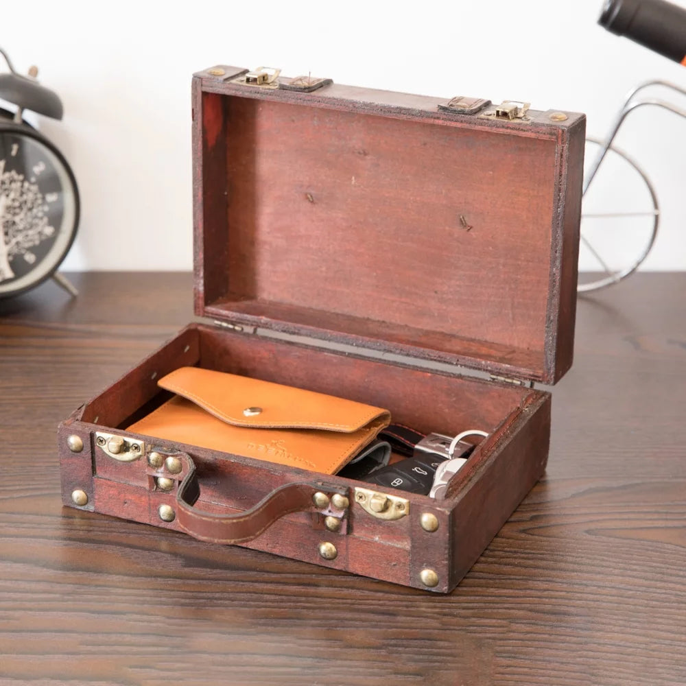 Old-fashioned small suitcase with straps